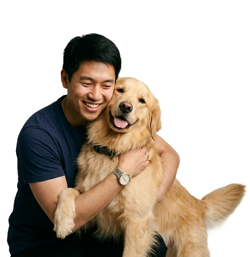 Happy dog parent hugging a Golden Retriever