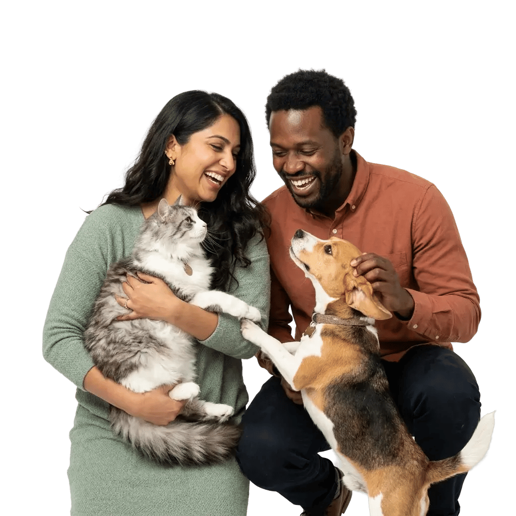 Happy pet parents with their dog and cat